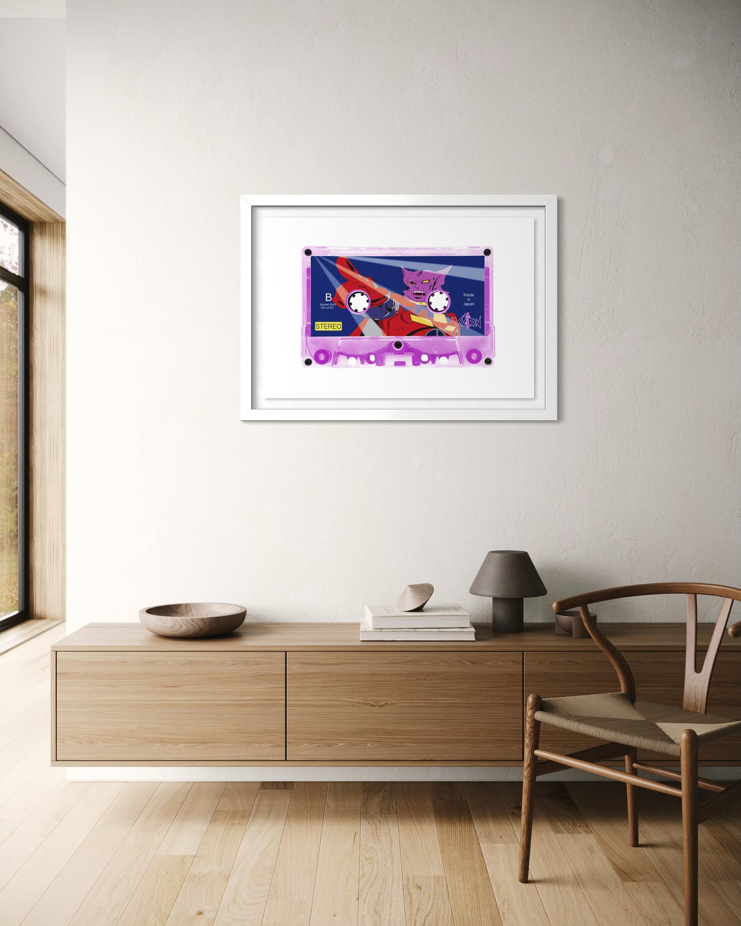 Framed artwork on a wall in a modern room with wooden furniture and a chair.